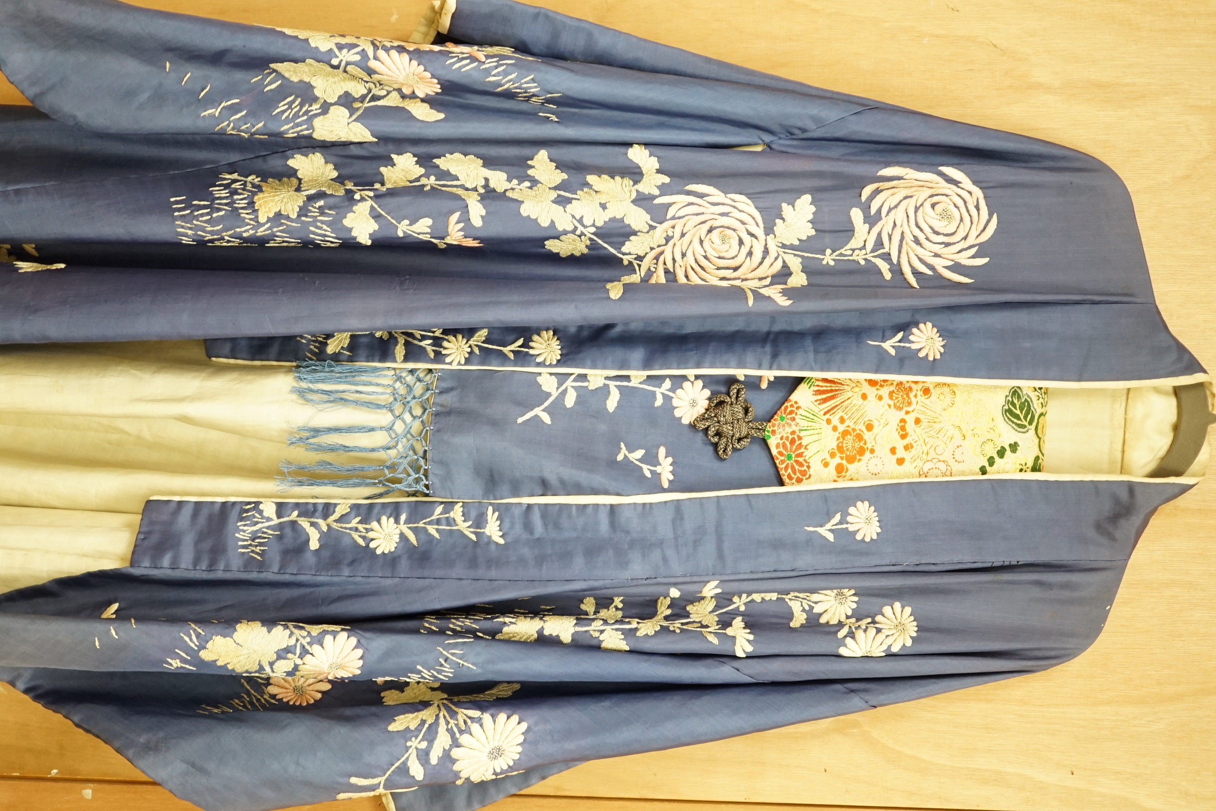 A Japanese embroidered silk kimono and a brocade obi